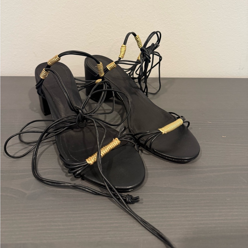 SCHUTZ Black and Gold Strappy Sandals